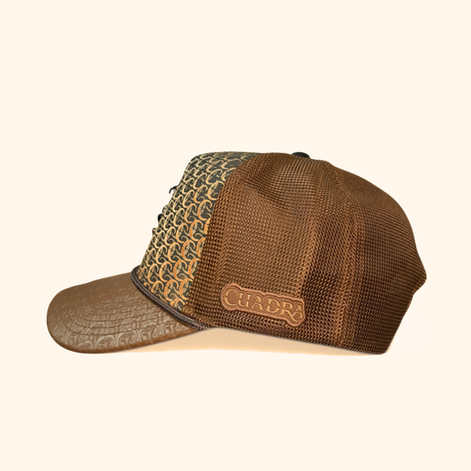 Side view of Cuadra patterned brown cap with logo patch
