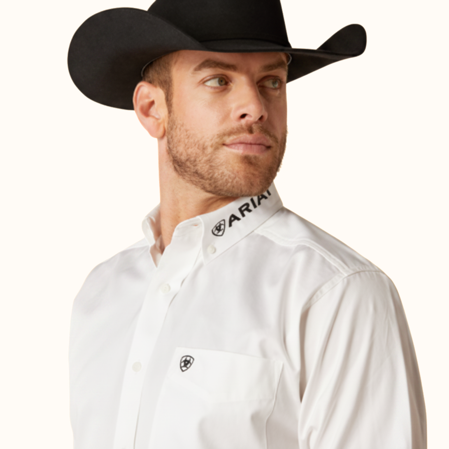 Close-up of Ariat Team Logo Twill Classic Fit Shirt collar and chest detail on model in white