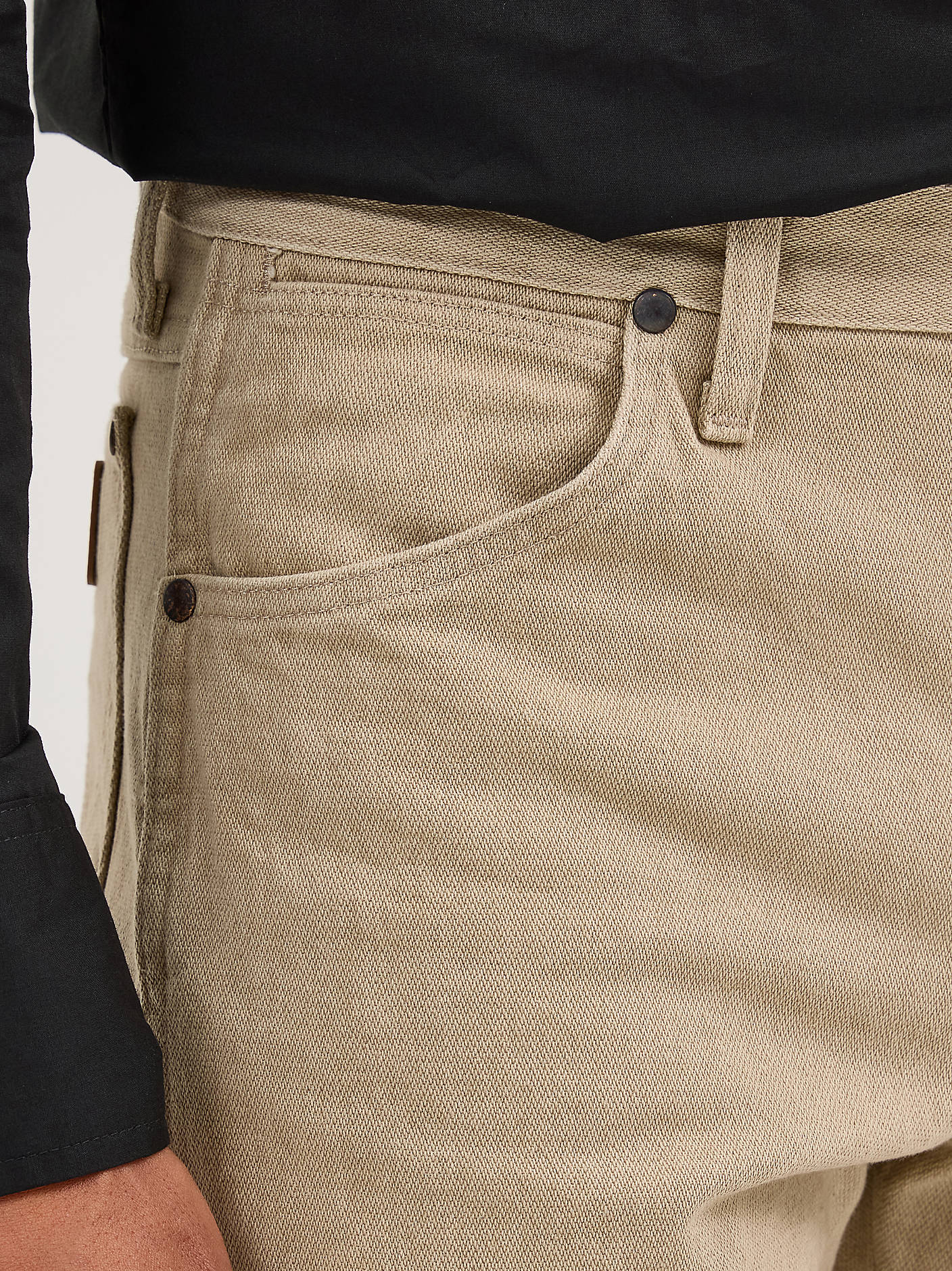 Wrangler beige cowboy jeans close-up fabric pocket detail