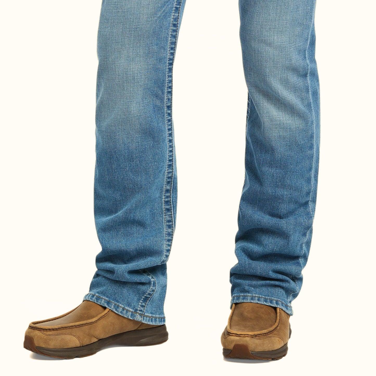 Lower leg and boot opening detail of Ariat M7 Slim Stretch Julian Straight Jean