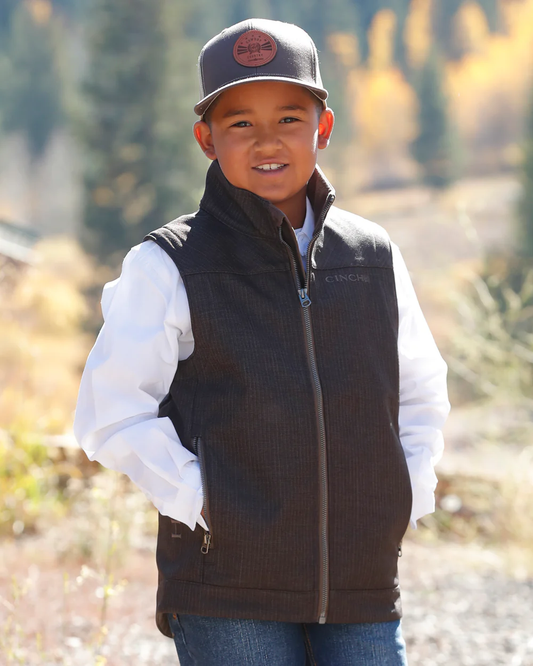 Front view of boy wearing Cinch Boys Bonded Vest in brown