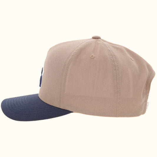 Hooey Classic Tan Blue Golf Logo Hat side view in tan and navy