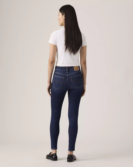 Levi’s 720 High Rise Super Skinny Women’s Jeans back view on model in dark blue denim