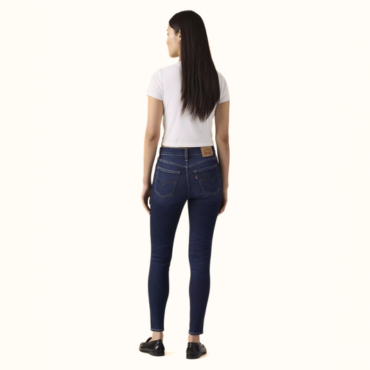 Levi’s 720 High Rise Super Skinny Women’s Jeans back view on model in dark blue denim