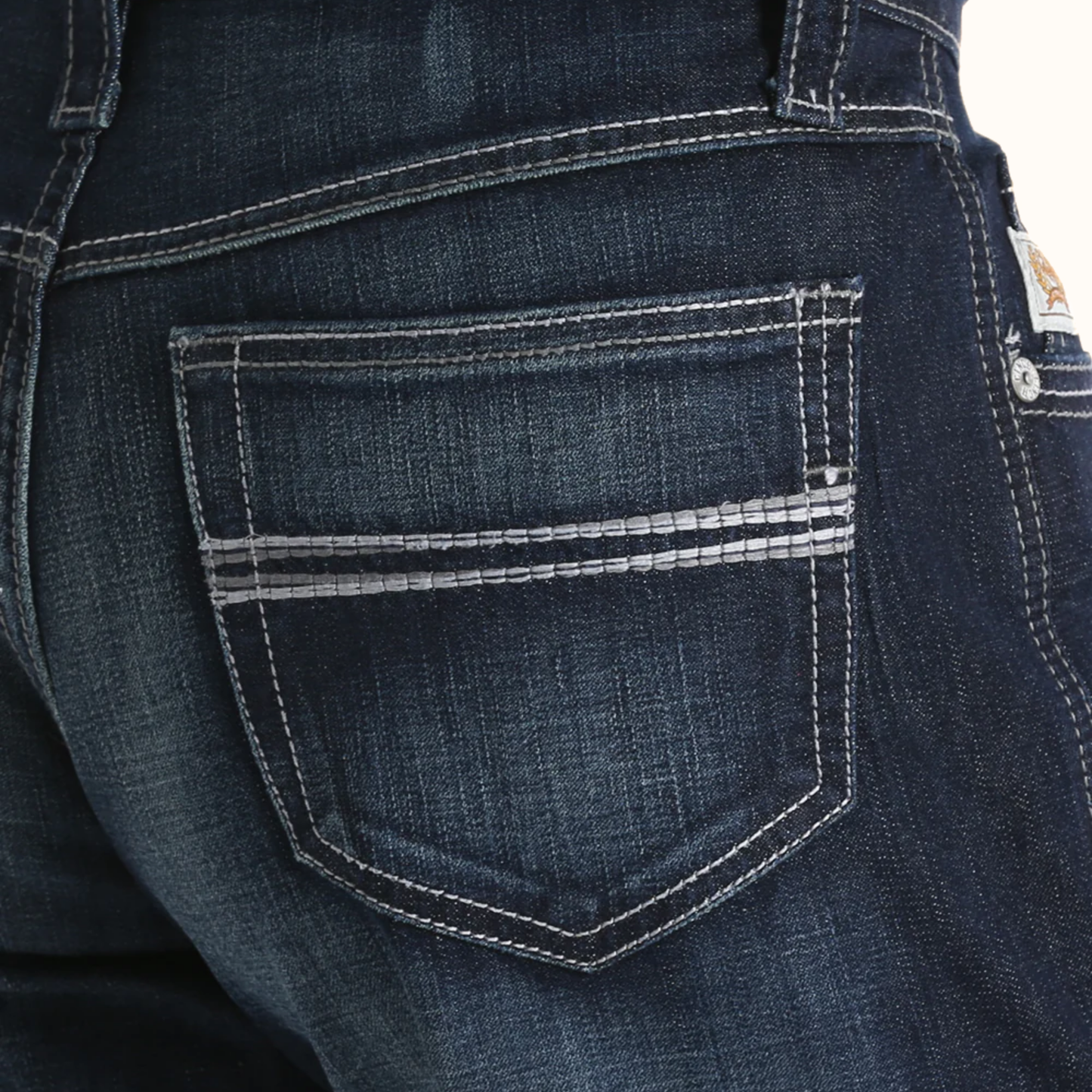 Close-up view of Cinch Men’s Carter 2.4 Performance Jeans back pocket stitching