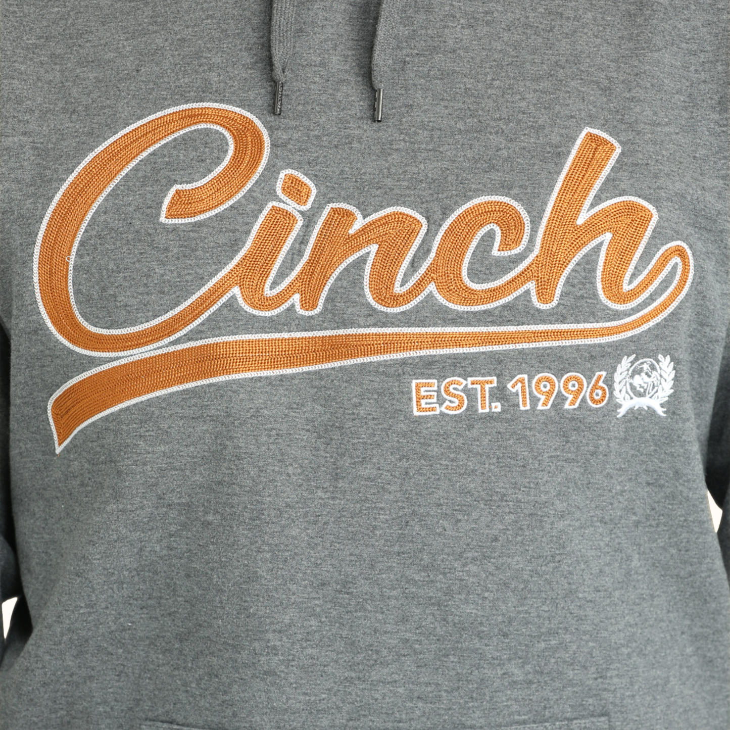 Close-up of Cinch logo graphic on gray hoodie