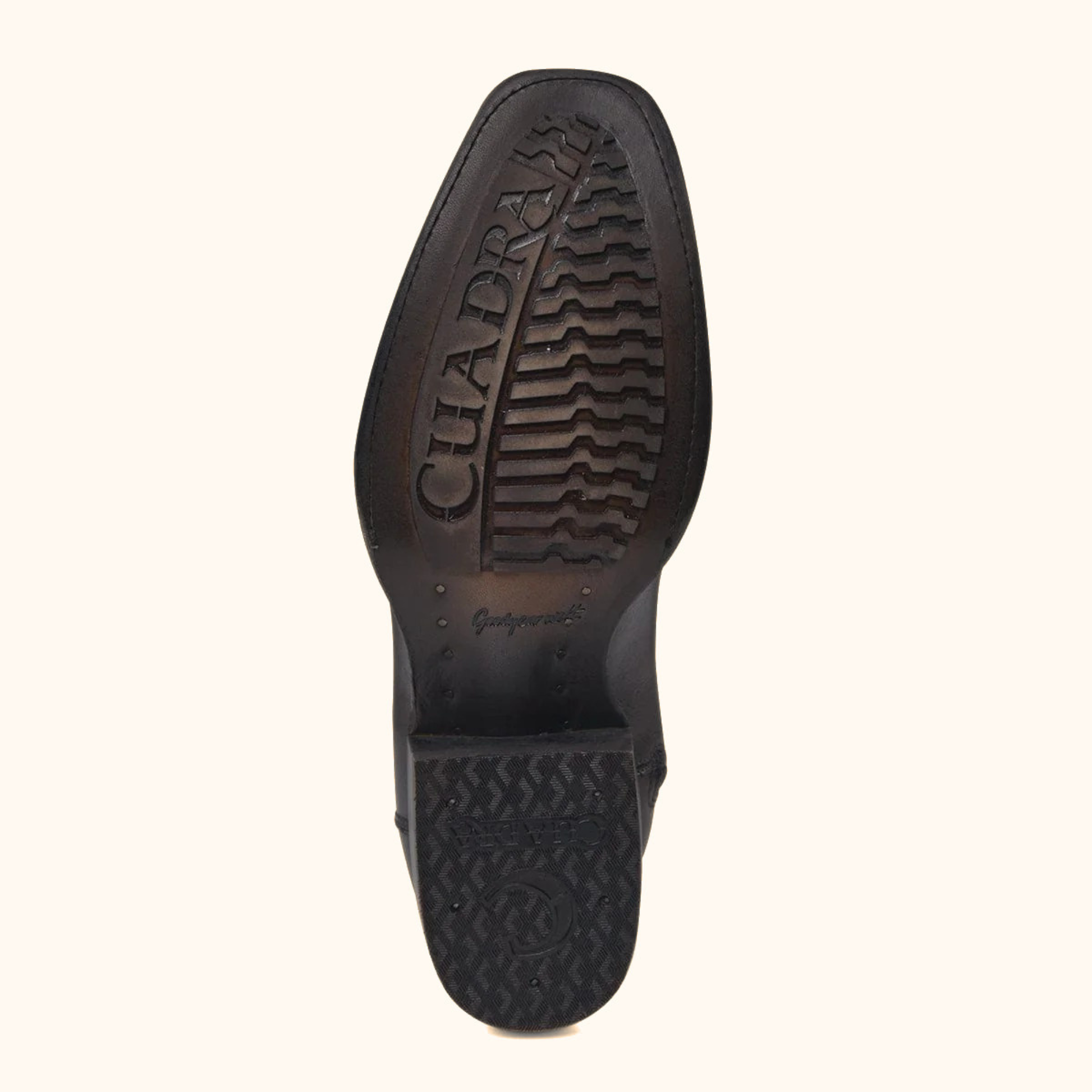 Outsole view of Cuadra Plunge Black Caiman Laser & Woven Narrow Square Toe Boot