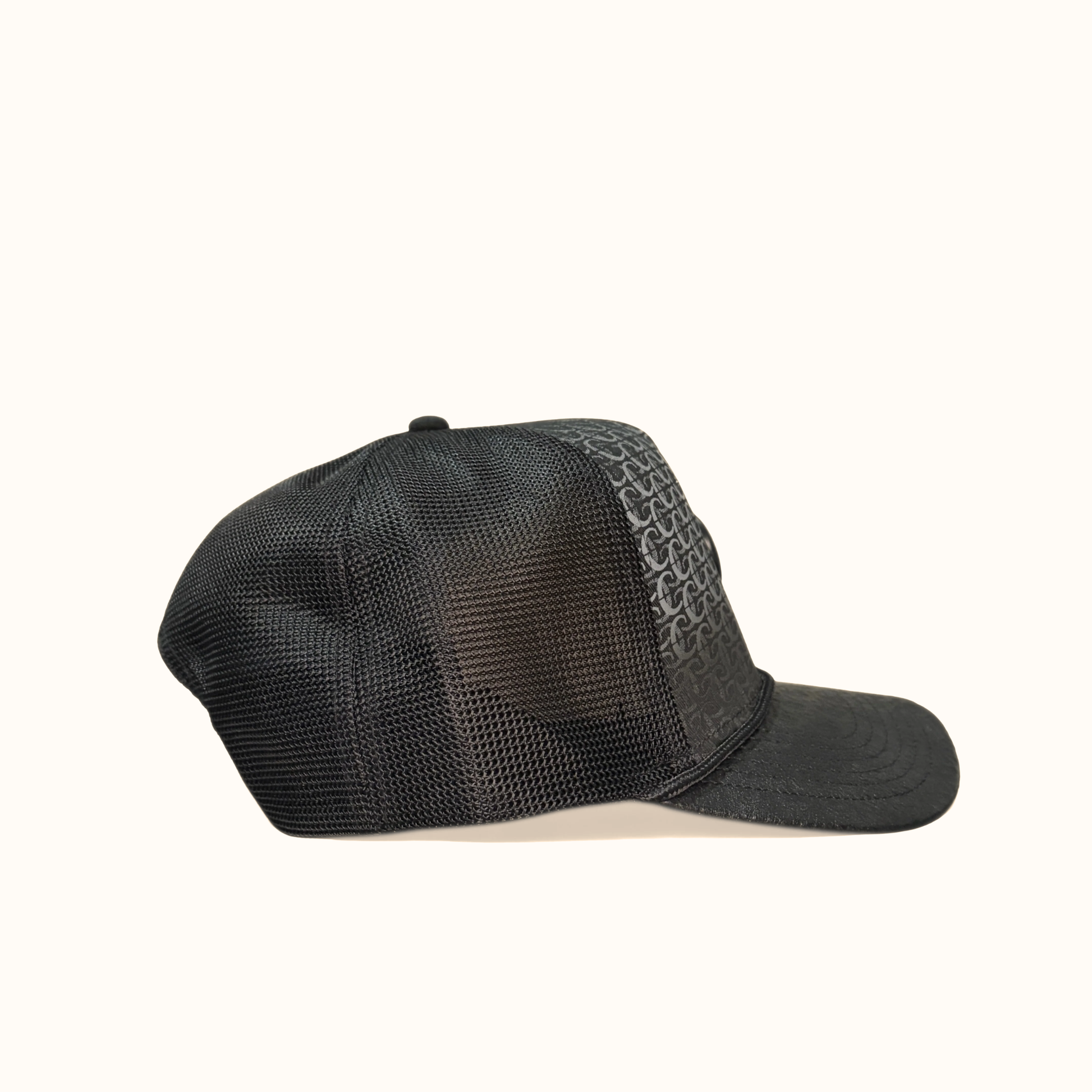 Side view of black Cuadra patterned cap