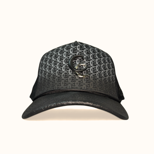Front view of black Cuadra patterned cap with embroidered logo patch