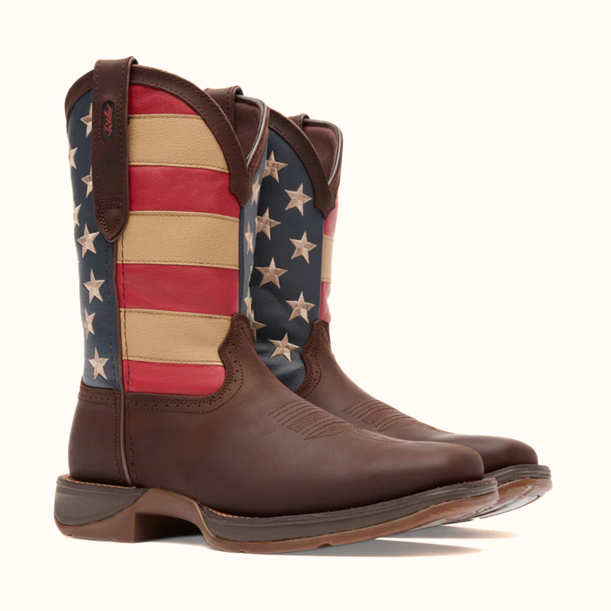 Pair of Durango Rebel Patriotic Pull-On Western Flag Boot angled side view in brown and red white blue shaft