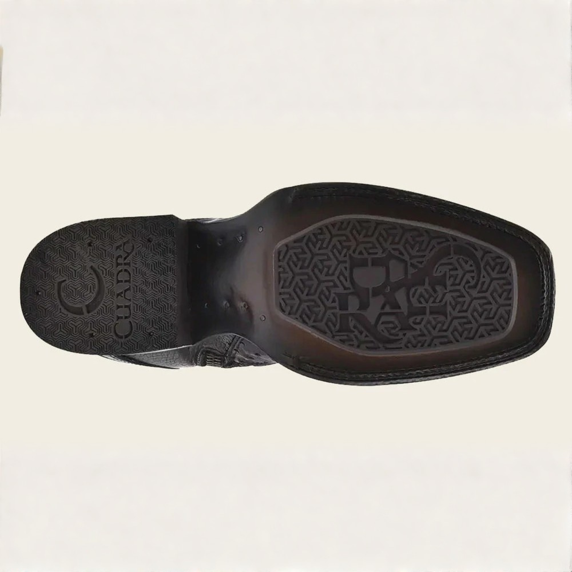 Outsole view of Cuadra Black Ostrich Zipper & Elastic Square Toe Boot