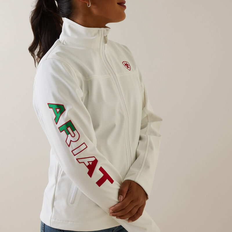 Side profile of woman wearing white Ariat Mexico softshell jacket