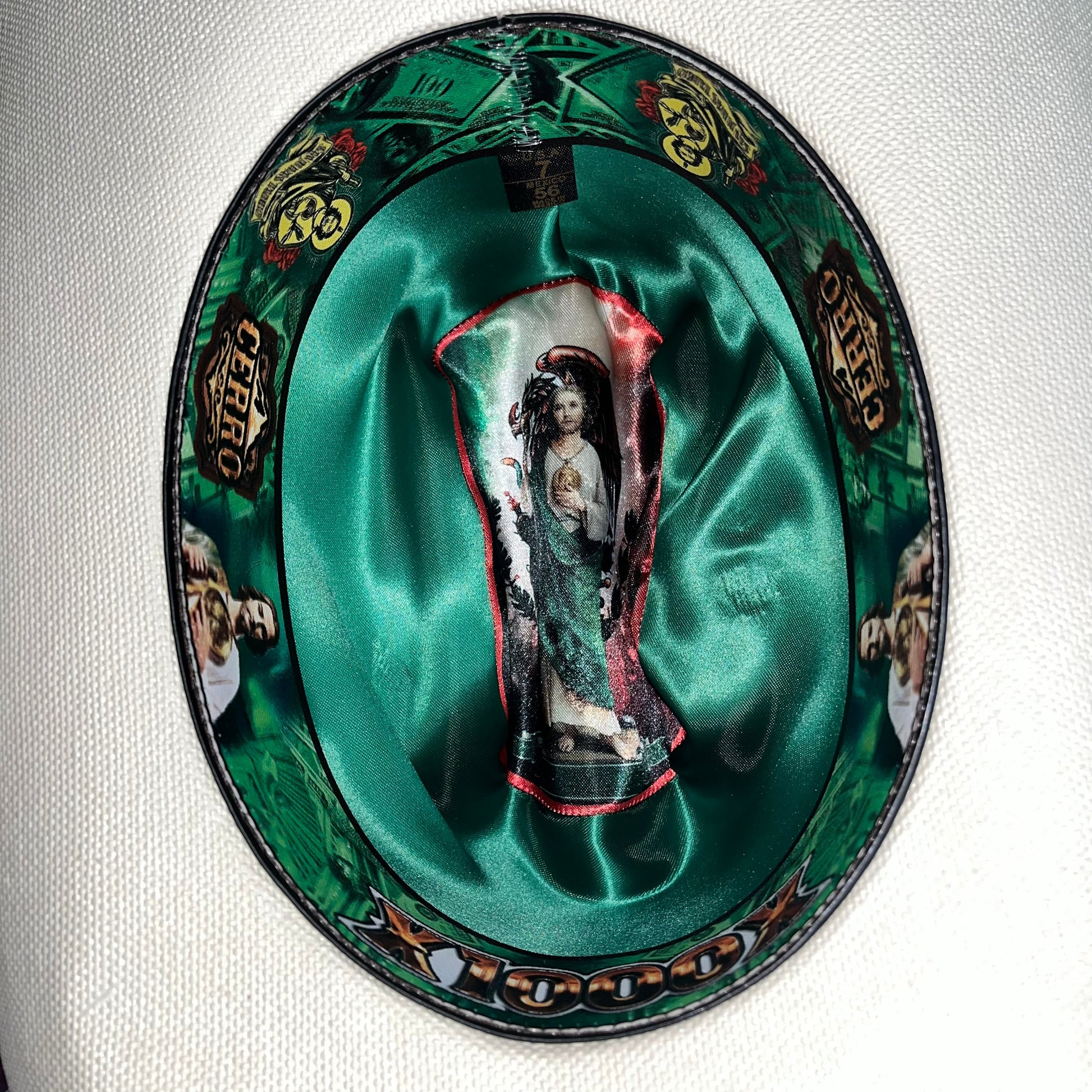 Close-up of San Judas medallion detail on Cerro 1000X San Judas Brown Hat Band Hat