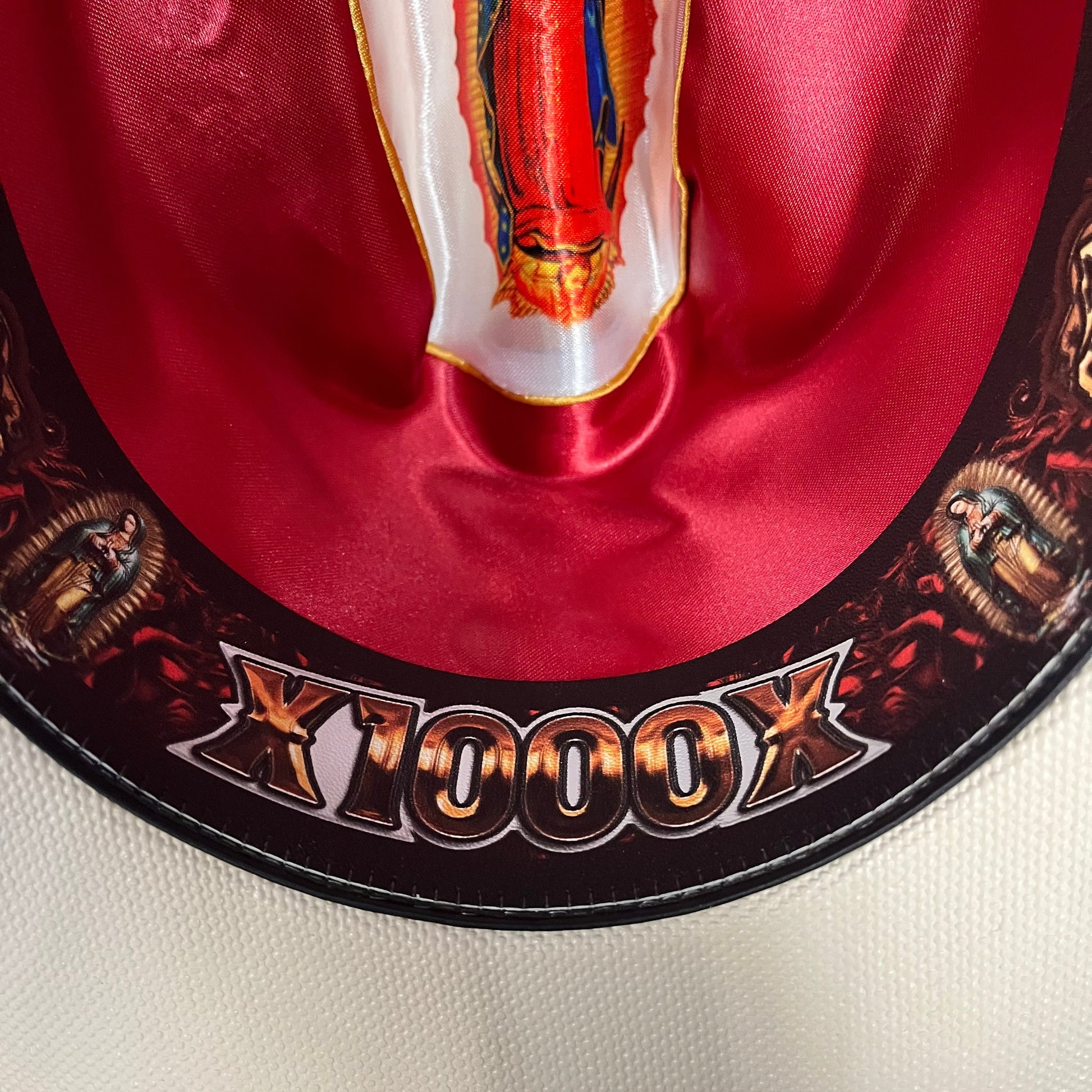 Close-up of red interior decorative detail on Cerro 1000X Virgen Maria Brown Hat Band Hat