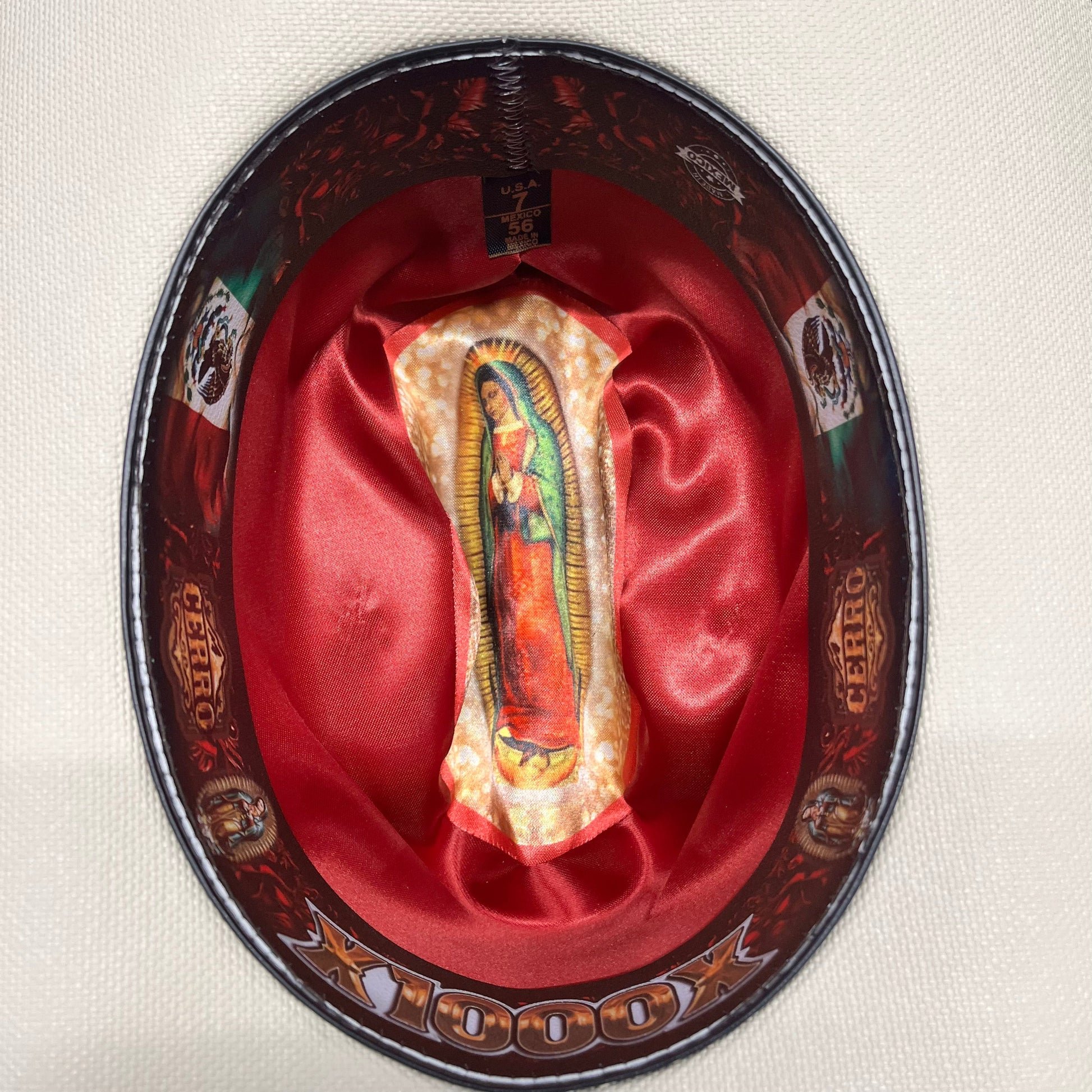 Close-up of Virgen Maria medallion detail on Cerro 1000X Virgen Maria Brown Hat Band Hat