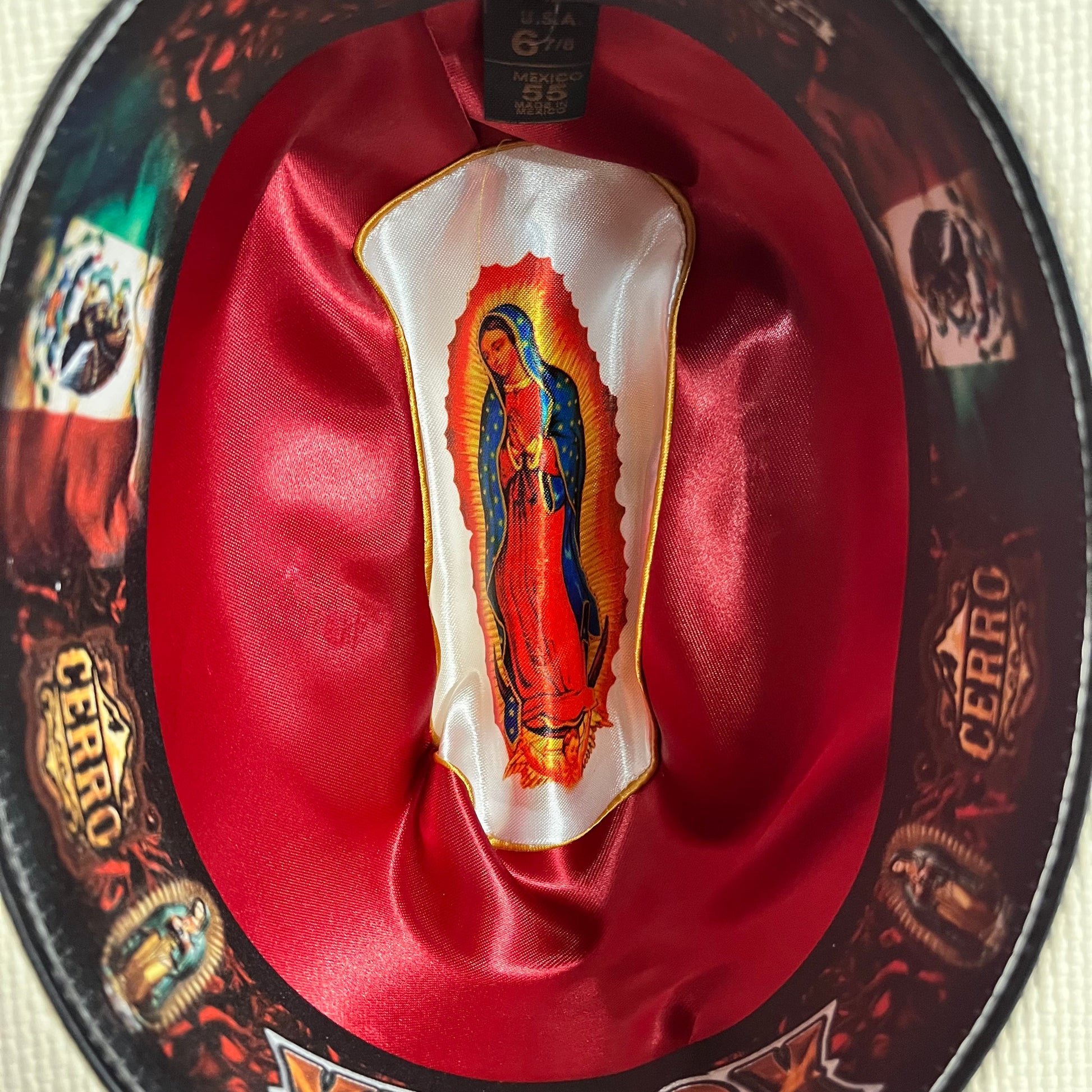 Close-up of Virgen Maria medallion detail on Cerro 1000X Virgen Maria Black Hat Band Hat