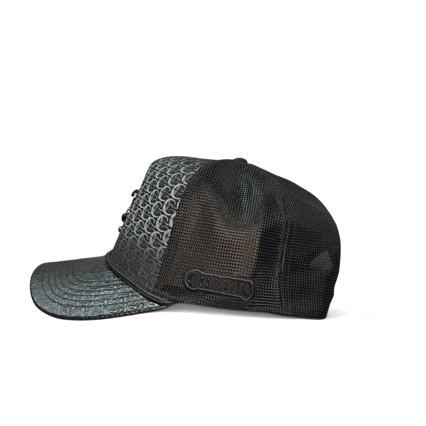 Side view of black Cuadra patterned cap with embroidered logo patch