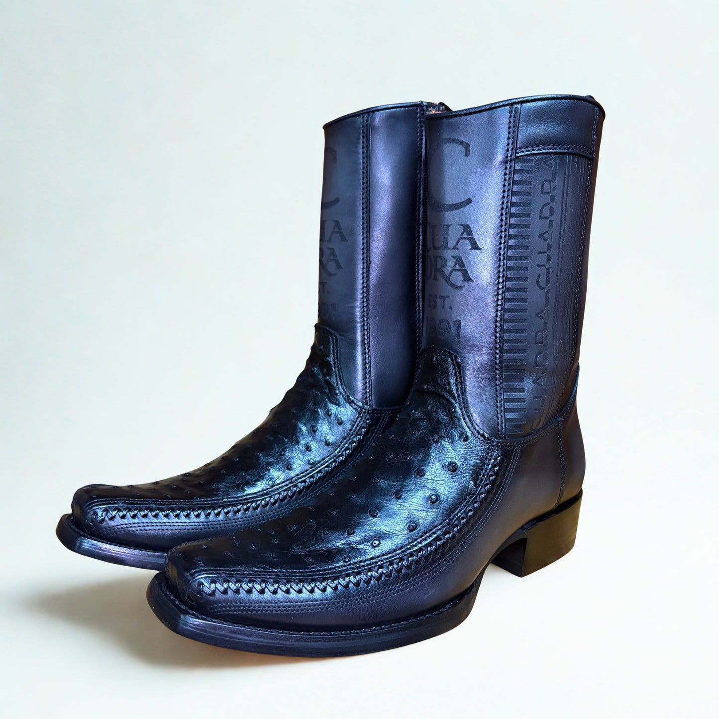 Pair of Cuadra Black Ostrich Lazer & Woven Narrow Square Toe Boots side profile in black leather