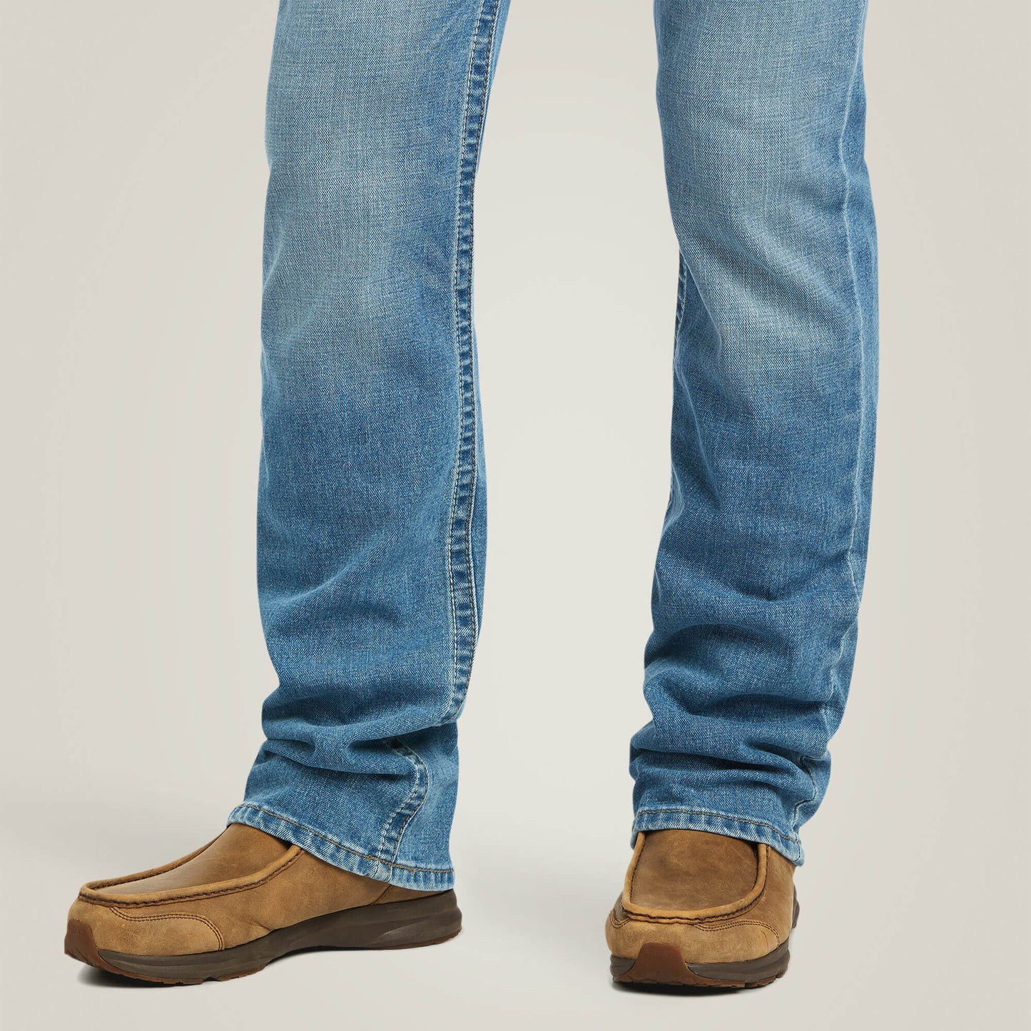 Lower leg and boot opening detail of Ariat M7 Slim Stretch Julian Straight Jean