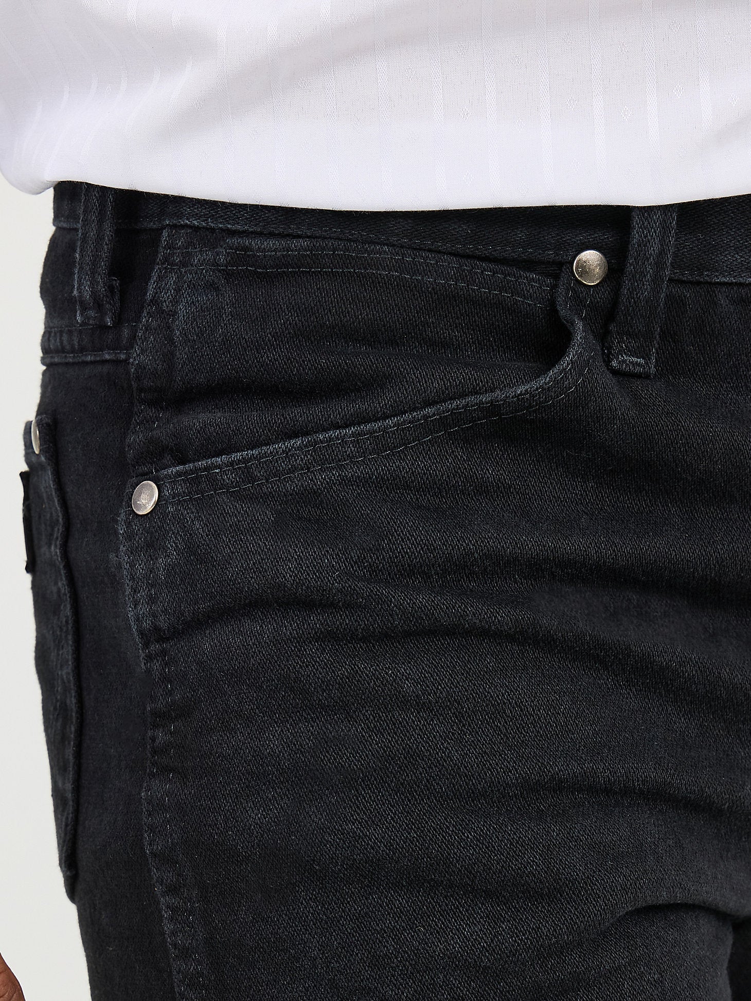 Close-up view of pocket and denim detailing