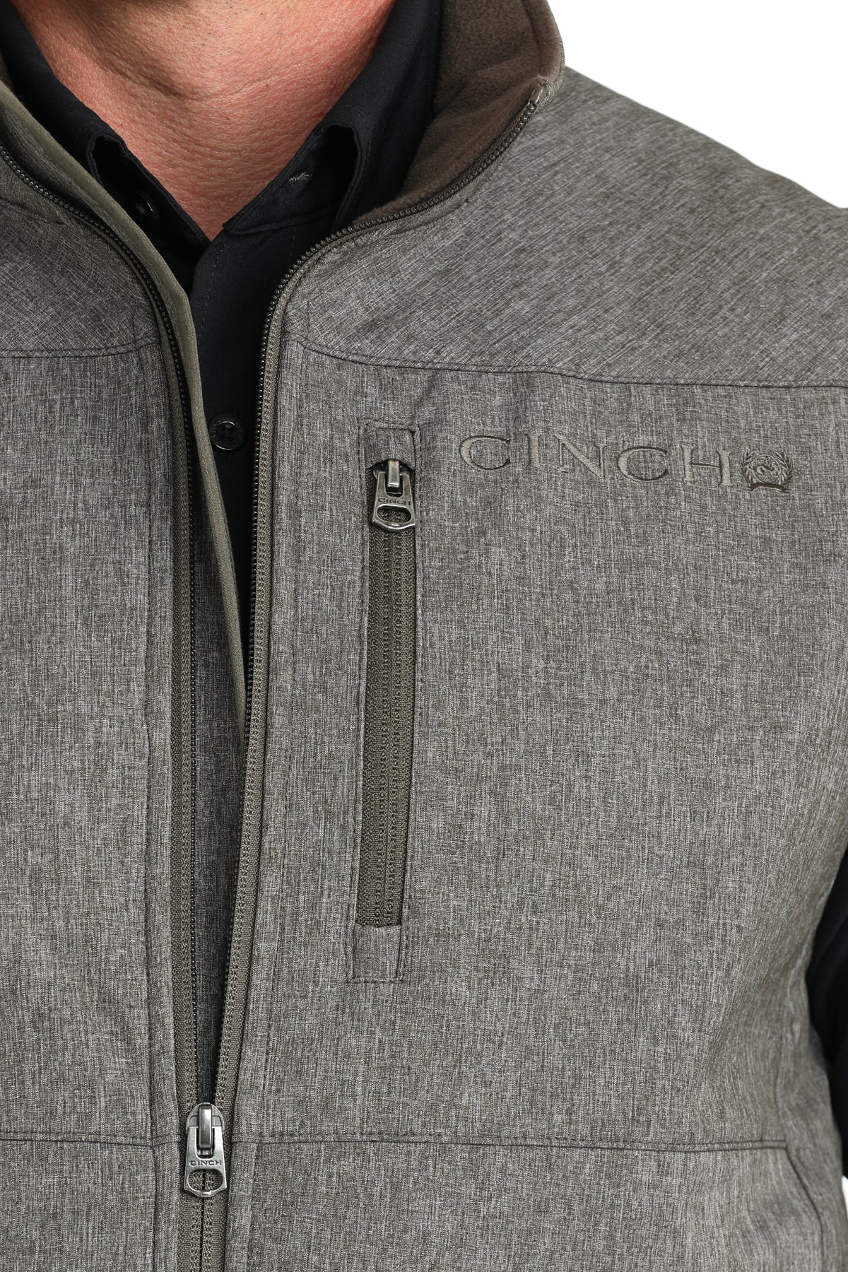 Close-up view of vest zipper and pocket details