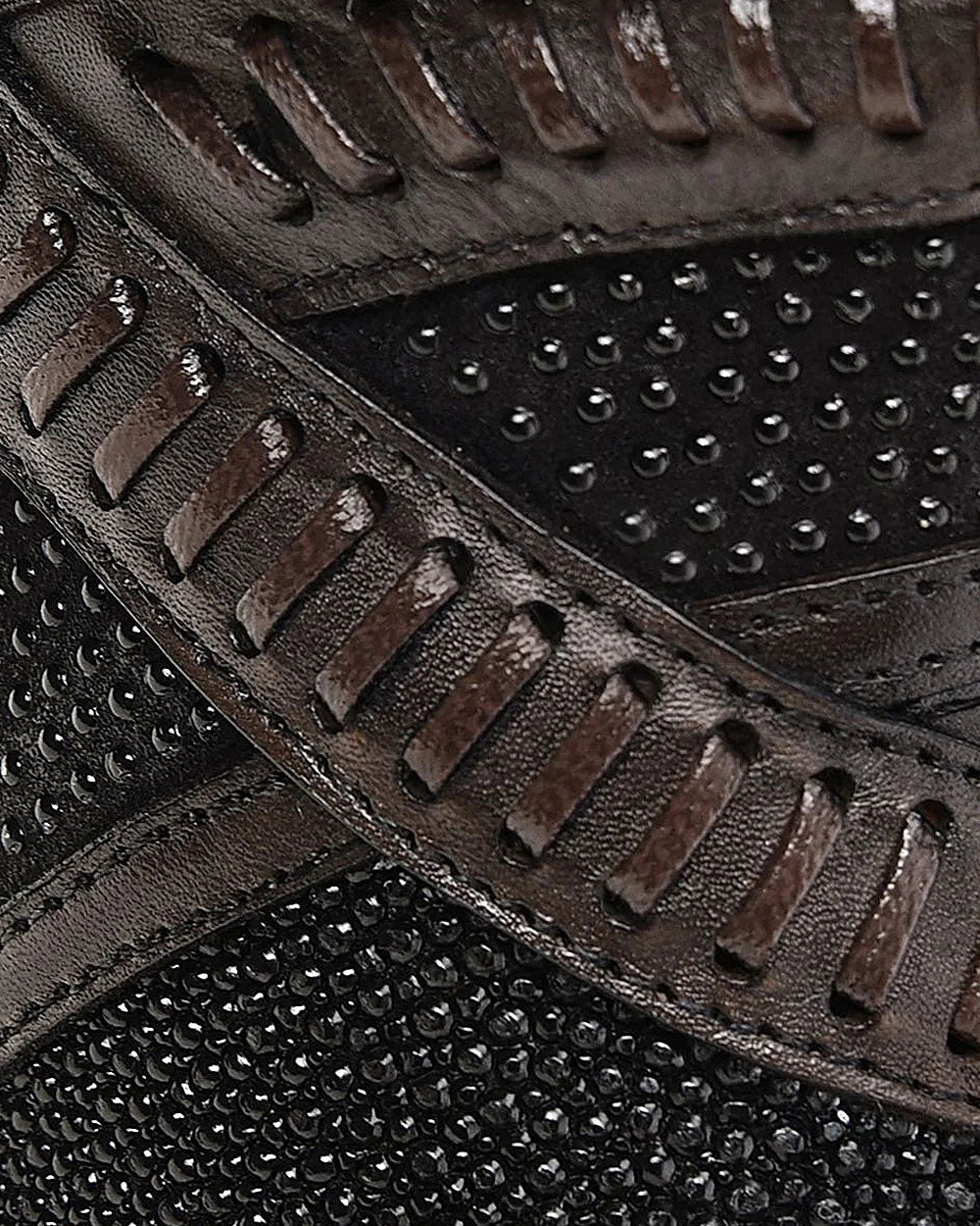 Close-up view of stingray leather and woven detail on Cuadra Tall Black Stingray Boot