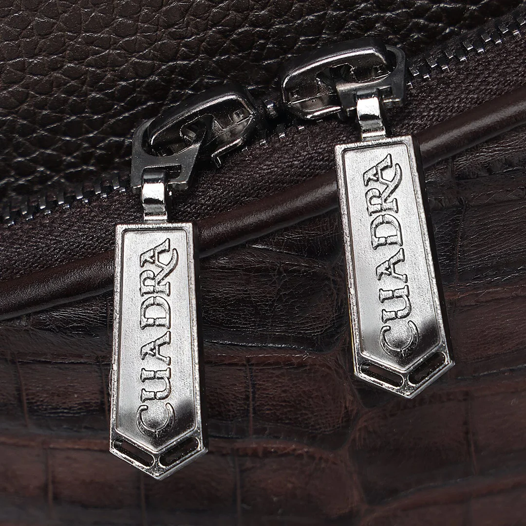 Close-up of zipper pulls on Cuadra Men’s Chocolate Caiman Zipper Bag