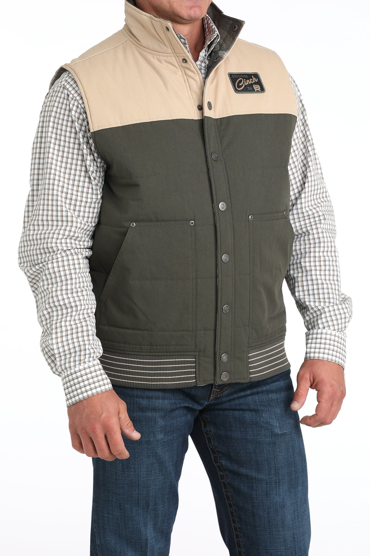 Front angle view of Cinch Reversible Vest in green and tan