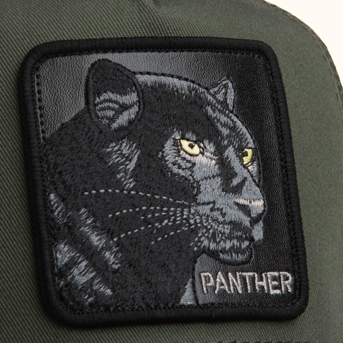 Goorin Panther olive trucker hat front patch view