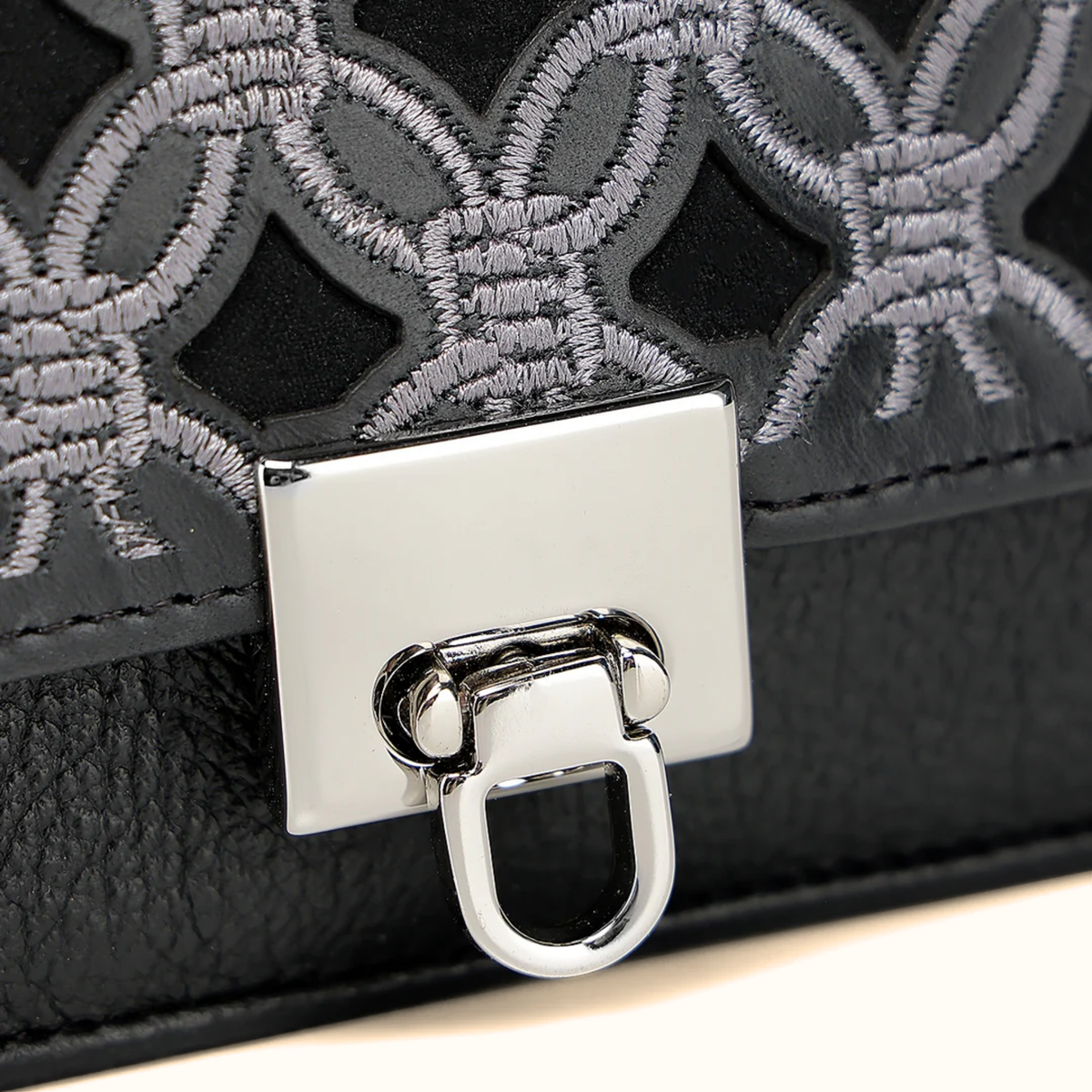 Cuadra women’s black embroidered leather wallet front close-up view