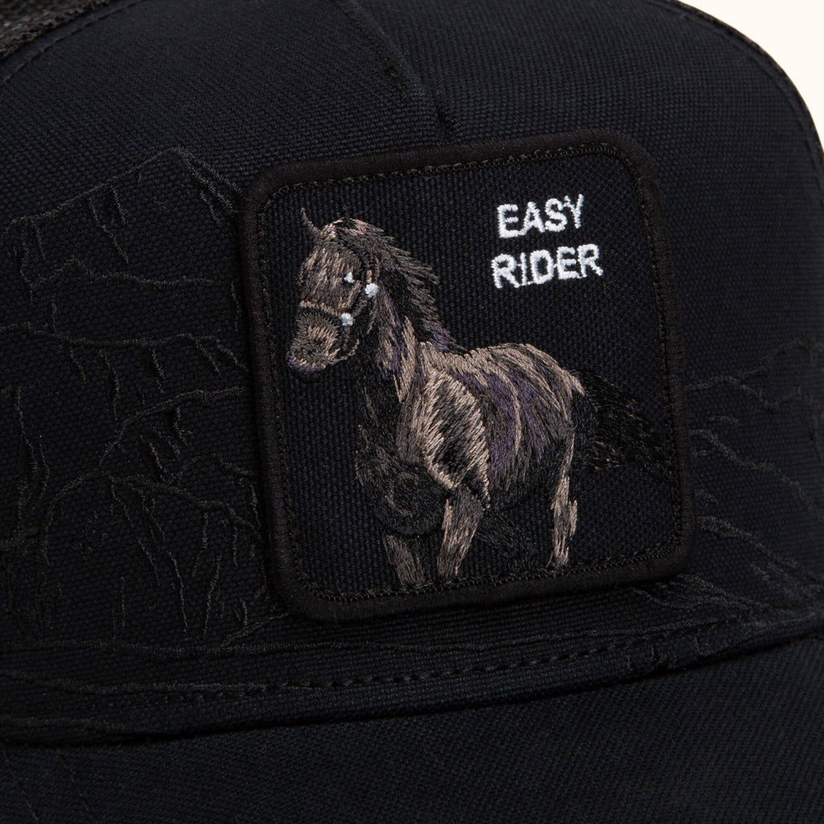 Goorin Badlands Stallion black trucker hat front patch view