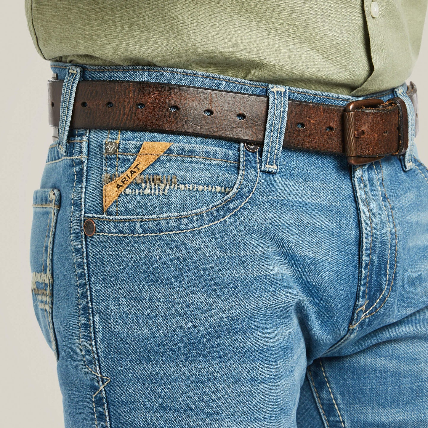 Close-up front pocket detail of Ariat M7 Slim Stretch Julian Straight Jean