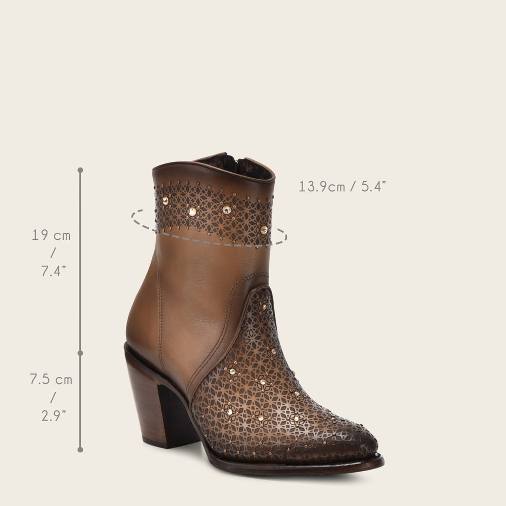 Close-up of perforated leather and crystal detail on Cuadra Honey Perforated Crystal Ankle Bootie with dimensions