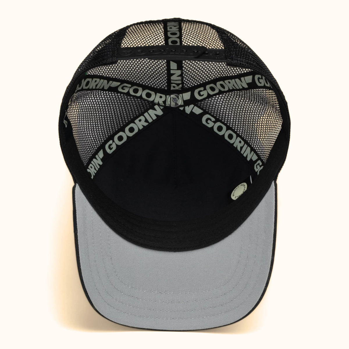 Goorin Bandit olive and black trucker hat bottom view
