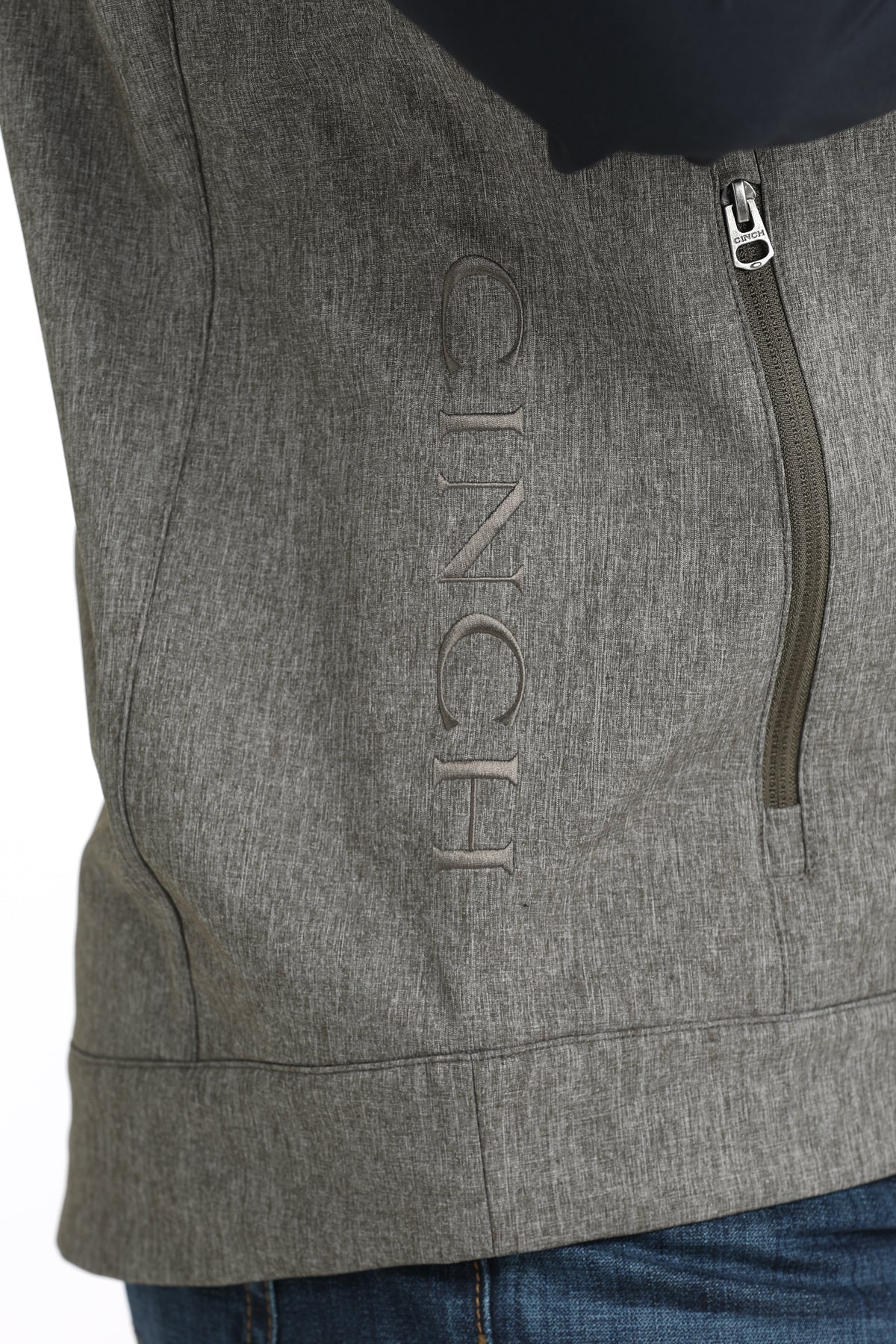 Close-up view of vest zipper and pocket details