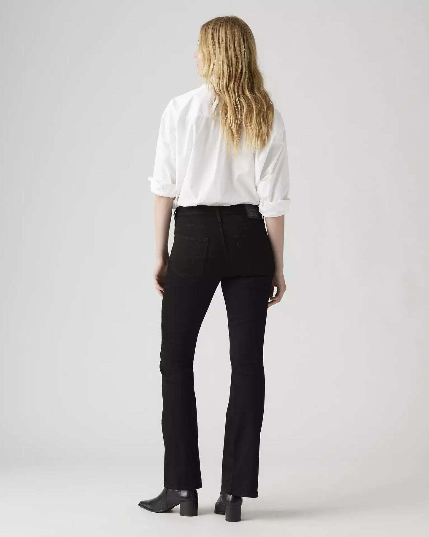 Back view of Levi’s 725 High Rise Bootcut Jeans on model
