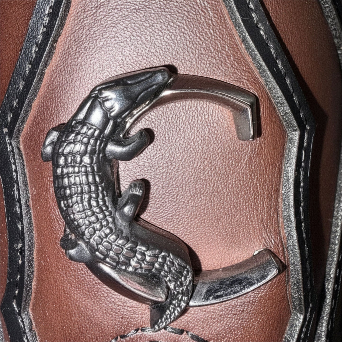 Close-up of side emblem detail on Cuadra Men’s Brown Caiman Embroidery and Woven Narrow Square Toe Boot